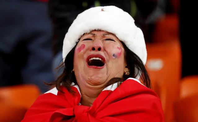 A Peru's fan cries at the end of the Russia 2018 World Cup Group C football match between France and Peru at the Ekaterinburg Arena in Ekaterinburg on June 21, 2018. (Photo by Damir Sagolj/Reuters)