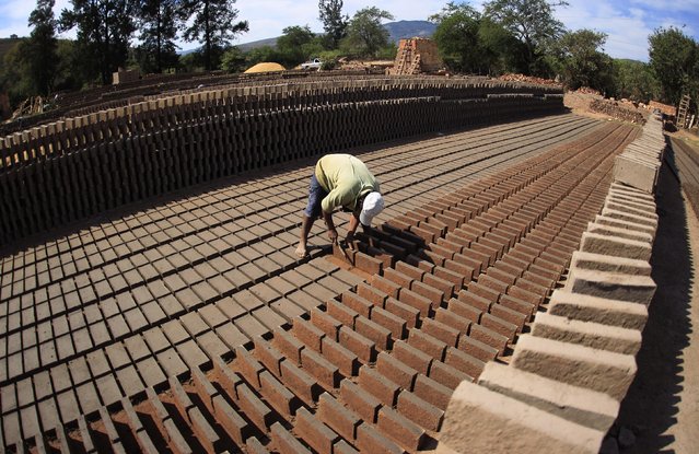 A worker works at a brick factory in Tixtla, on the outskirts of Chilpancingo, in the Guerrero state, January 26, 2015. (Photo by Jorge Dan Lopez/Reuters)
