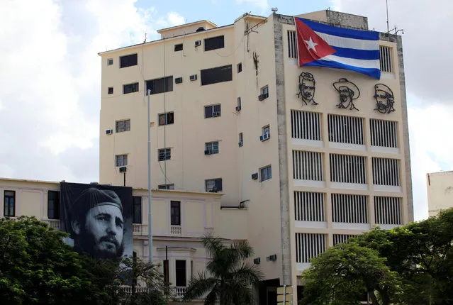 A picture of Cuban late former president Fidel Castro hangs on a building in Havana, Cuba, November 26, 2016. (Photo by Enrique de la Osa/Reuters)