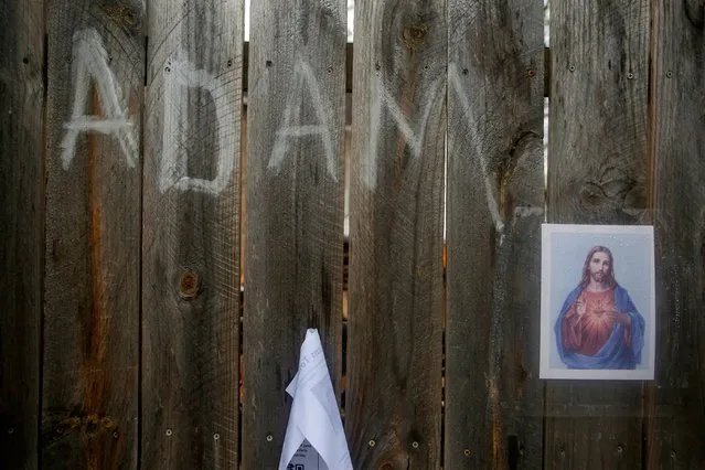 A memorial to 13-year-old Adam Toledo is growing at the site where he was shot dead by a police officer, in Chicago, Illinois, U.S., April 19, 2021. (Photo by Eileen T. Meslar/Reuters)