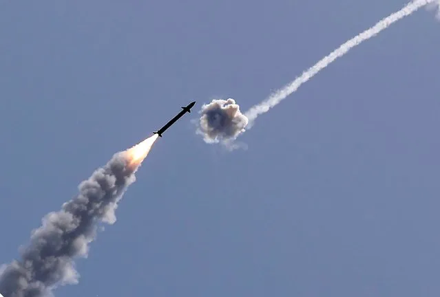 Israel's Iron Dome aerial defence system intercepts a rocket launched from the Gaza Strip, controlled by the Palestinian Hamas movement, above the southern Israeli city of Ashkelon, on May 11, 2021. Israel and Hamas exchanged heavy fire, in a dramatic escalation between the bitter foes sparked by unrest at Jerusalem's flashpoint Al-Aqsa Mosque compound. (Photo by Jack Guez/AFP Photo)