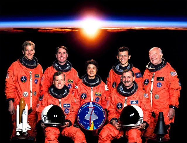 Five astronauts based at the Johnson Space Center (JSC) and two payload specialists take a break from their training schedule to pose for the Sts-95 pre-flight portrait. Seated Are Astronauts Curtis L. Brown Jr. (Right), Mission Commander; And Steven W. Lindsey, Pilot. Standing, From The Left, Are Scott F. Parazynski And Stephen K. Robinson, Both Mission Specialists; Chiaki Mukai, Payload Specialist Representing Japan's National Space Development Agency (Nasda); Pedro Duque, Mission Specialist Representing The European Space Agency (Esa); And U.S. Sen. John H. Glenn Jr., Payload Specialist. The Seven Are Scheduled To Be Launched Into Earth Orbit Aboard The Space Shuttle Discovery In Late October Of This Year. (Photo By Nasa/Getty Images)