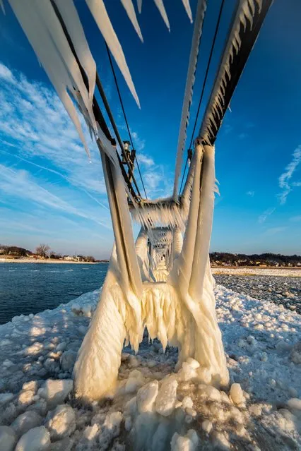 Ice coats the pier structures at South Haven. (Photo by Mike Kline/Barcroft Media)