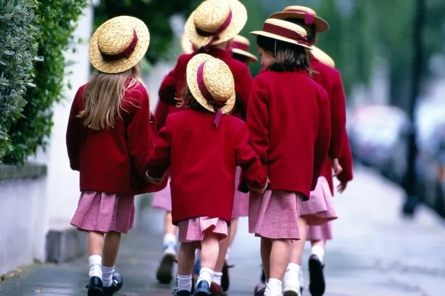 A group of schoolgirls, walking. (Photo by Yellow Dog Productions/Getty Images)