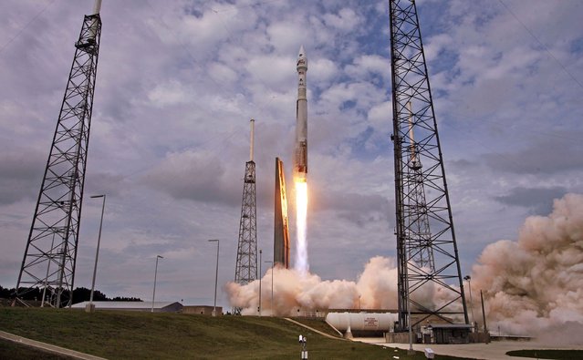 An AtlasV rocket, carrying the Maven spacecraft, blasts off at Cape Canaveral Air Force Station, Fla., on Monday, Nov. 18, 20131. Maven is on a 10-month journey will directly assess the atmosphere of the planet Mars. (Red Huber/Orlando Sentinel/MCT)