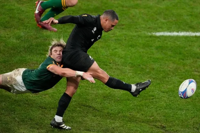 South Africa's Faf de Klerk tries to tackle New Zealand's Aaron Smith during the Rugby World Cup final match between New Zealand and South Africa at the Stade de France in Saint-Denis, near Paris Saturday, October 28, 2023. (Photo by Themba Hadebe/AP Photo)