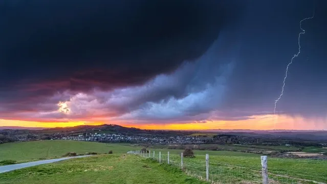 A threatening storm colours the sky at sunset on the Isle of Wight at Brading, England on April 16, 2023 where the weather is expected to be largely dry and sunny for most of the week. (Photo by Island Visions/BNPS)