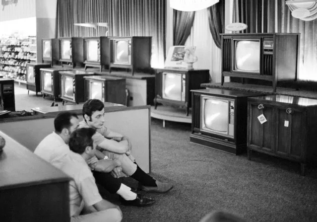 In this July 16, 1969, file photo people watch the Apollo 11 Saturn V rocket launch on multiple TV's at a Sears department store in White Plains, N.Y. Sears has filed for Chapter 11 bankruptcy protection Monday, Oct. 15, 2018, buckling under its massive debt load and staggering losses. The company once dominated the American landscape, but whether a smaller Sears can be viable remains in question. (Photo by Ron Frehm/AP Photo)