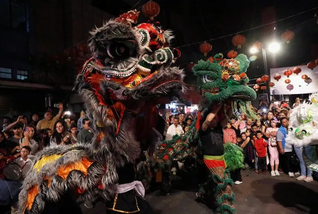 People perform a traditional Chinese lion dance as to mark the Chinese Lunar New Year of the Pig in Chinatown in Mexico City, Mexico February 6, 2019. (Photo by Henry Romero/Reuters)