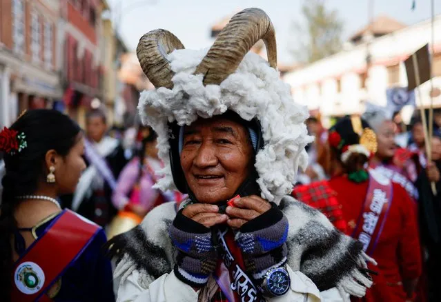 A man dressed as a sheep takes part in a parade to celebrate Tamu Lhosar, a New Year festival of the Gurung community in Kathmandu, Nepal on December 31, 2023. (Photo by Navesh Chitrakar/Reuters)