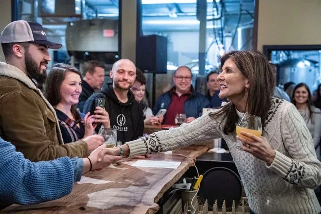 Republican presidential hopeful and former UN Ambassador Nikki Haley speaks with supporters at Deciduous Brewing in Newmarket, while campaigning in New Hampshire, January 21, 2024. (Photo by Joseph Prezioso/AFP Photo)