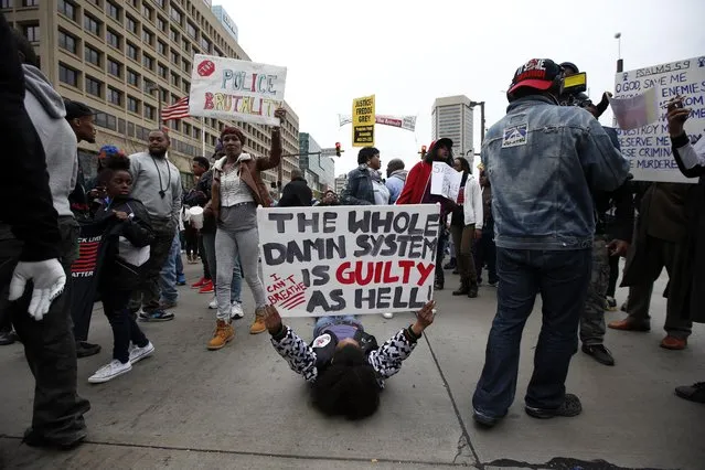 Marchers block the Pratt Street after a march to City Hall for Freddie Gray, Saturday, April 25, 2015 in Baltimore. (Photo by Alex Brandon/AP Photo)