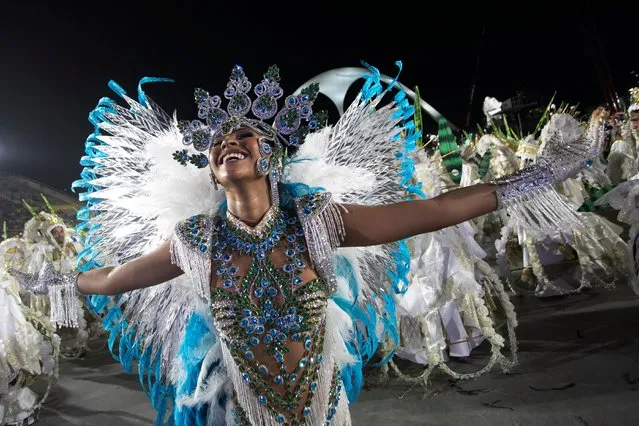 A performer from the Portela samba school parades during Carnival celebrations at the Sambadrome in Rio de Janeiro, Brazil, early Tuesday, February 13, 2024. (Photo by Bruna Prado/AP Photo)