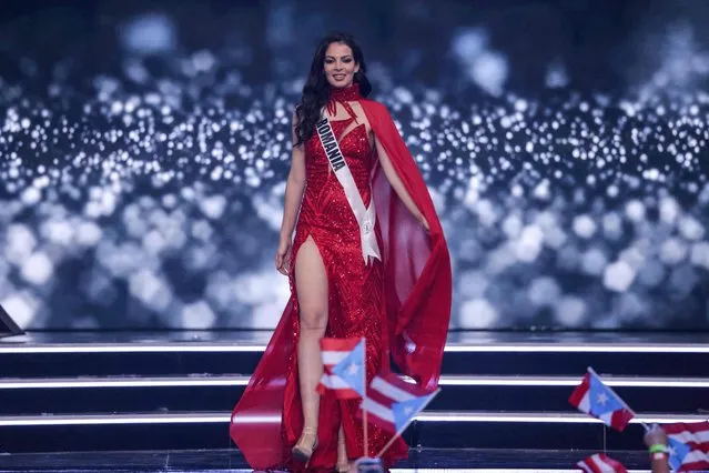 Miss Romania, Carmina Cotfas, presents herself on stage during the preliminary stage of the 70th Miss Universe beauty pageant in Israel's southern Red Sea coastal city of Eilat on December 10, 2021. (Photo by Menahem Kahana/AFP Photo)