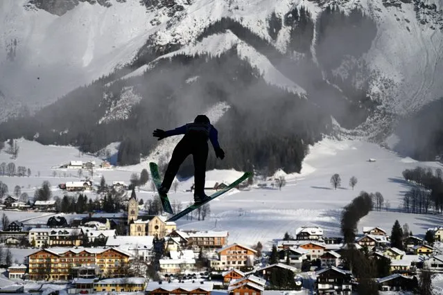 Marte Leinan Lund of Norway in action during a trial jump for the ski jumping portion for the Women's Gundersen Normal Hill HS98/5km competition of the FIS Nordic Combined World Cup in Ramsau, Austria, 17 December 2021. (Photo by Christian Bruna/EPA/EFE)