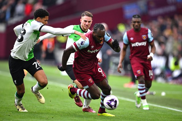 Michail Antonio of West Ham United is challenged by Jarell Quansah of Liverpool during the Premier League match between West Ham United and Liverpool FC at London Stadium on April 27, 2024 in London, England. (Photo by Justin Setterfield/Getty Images)
