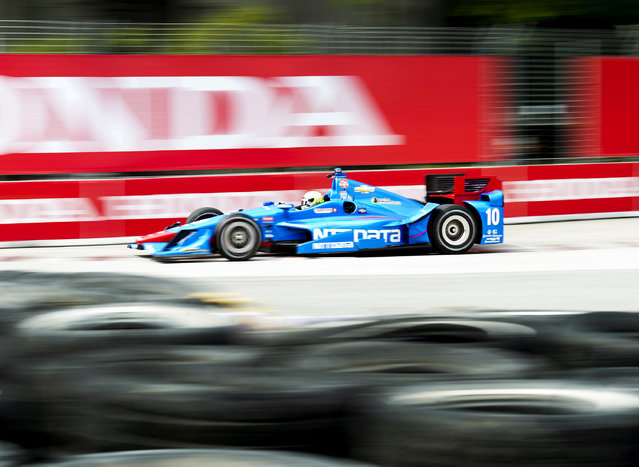 Tony Kanaan, of Brazil, makes a corner during practice for the IndyCar auto race Saturday, June 13, 2015, in Toronto. (Nathan Denette/The Canadian Press via AP)