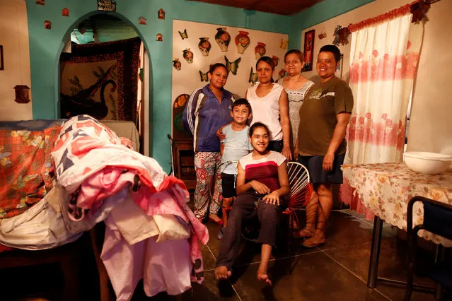 Victoria Mata (2nd R) poses for picture next to her relatives (L-R) Naibeth Pereira, Sebastian, Delis Pereira, Denis Pereira (R) and Wenderly (Front), at their home in Caracas, Venezuela April 21, 2016. “We are eating less because you can't find the foods and when they appear, the queues are hellish and we can't buy them. Now we do not eat three meals, we are eating two meals a day. If we have them”, Mata said. (Photo by Carlos Garcia Rawlins/Reuters)
