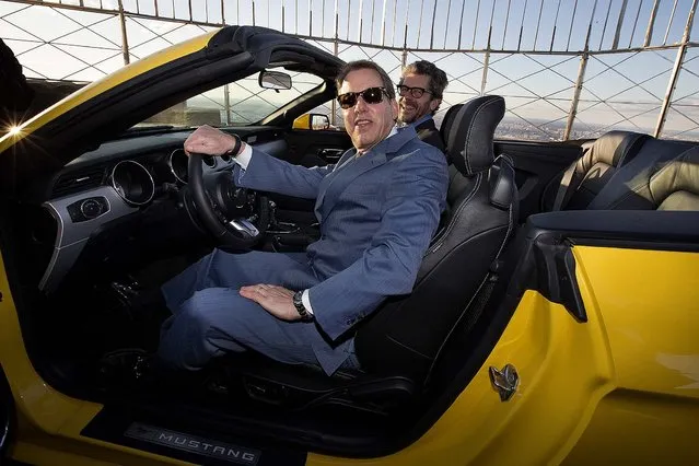 Bill Ford, Ford Motor Company's executive chairman, foreground, and Anthony E. Malkin, Empire State Realty Trust Chairman, President, and CEO, sit in the all-new 2015 Mustang convertible as it's introduced on the 86th floor observation deck of the Empire State Building during the New York International Auto Show. (Photo by John Minchillo/Associated Press)