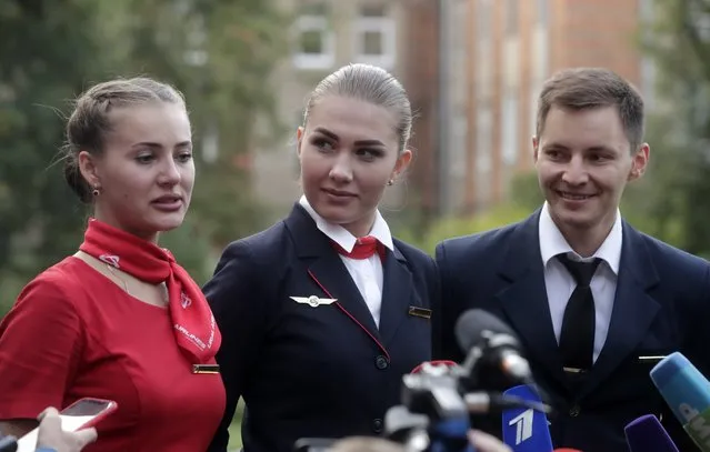 The crew of the Russian Ural Airlines' Airbus A321 plane during a press briefing following a hard landing near Zhukovsky International Airport due to an engine fire on August 15, 2019. (Photo by Mikhail Metzel/TASS)