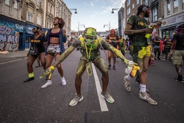 Revellers take part in the Notting Hill Carnival in London, Britain on August 25, 2019. (Photo by Alamy Live News)