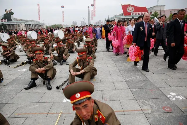 Participants leave the capital's main ceremonial square after a mass rally and parade, a day after the ruling party wrapped up its first congress in 36 years by elevating him to party chairman, in Pyongyang, North Korea, May 10, 2016. (Photo by Damir Sagolj/Reuters)