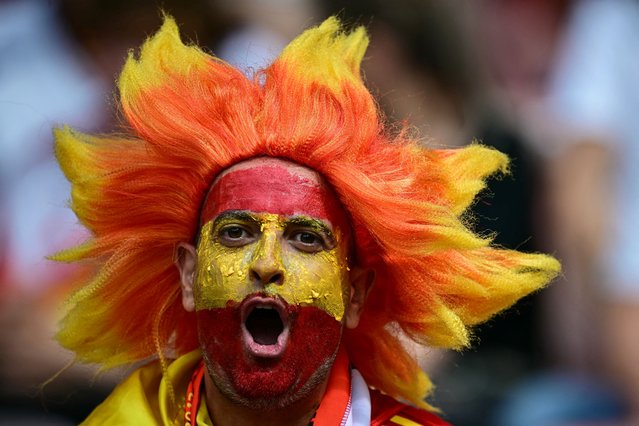 A Spain supporter cheers before the start of the UEFA Euro 2024 quarter-final football match between Spain and Germany at the Stuttgart Arena in Stuttgart on July 5, 2024. (Photo by Tobias Schwarz/AFP Photo)