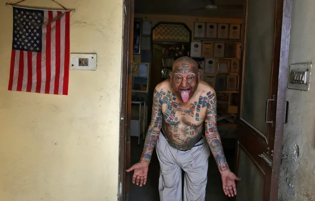 Guinness Rishi, 74, multiple world record holder including most flags tattooed on his body, poses for a photograph outside his apartment in New Delhi, India May 20, 2016. (Photo by Cathal McNaughton/Reuters)