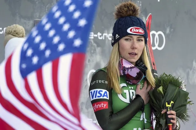 United States' Mikaela Shiffrin, winner of an alpine ski, women's World Cup giant slalom, listens to the national anthem, in Lienz, Austria, Saturday, December 28, 2019. (Photo by Piermarco Tacca/AP Photo)
