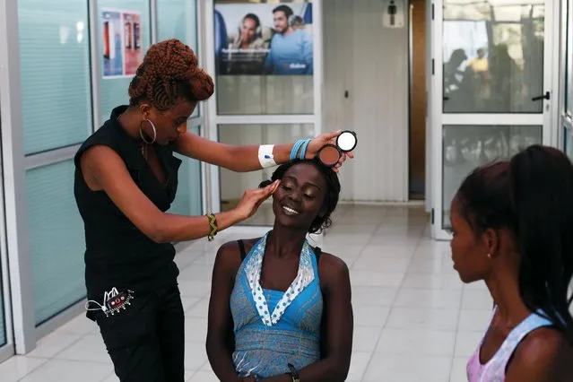 A contestant has makeup applied before the “Beauties of South Sudan” beauty contest in Juba, South Sudan, on Jule 13, 2014. (Photo by Andreea Campeanu/Reuters)