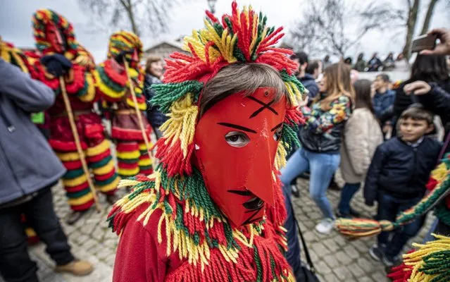 Revellers from the Portuguese village of Podence dressed in a traditional costume during annual Carnival festivities on February 25, 2020 in Macedo de Cavaleiros, Portugal. (Photo by Octavio Passos/Getty Images)