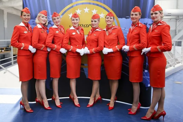 In this photo taken on Tuesday, June 20, 2017, some of Aeroflot's flight attendants pose for a photo at the World's Best Airline at the 2017 Skytrax World Airline Awards celebration at Paris Air Show, in Le Bourget, east of Paris, France. The Moscow City Court is to due to rule in the case of two flight attendants who are suing Russia's flagship airline for taking them off the prestigious long-haul flights because of their looks. (Photo by Marina Lystseva/AP Photo)