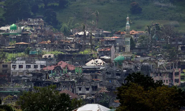 Damaged buildings and houses are seen as government troops continue their assault on its 105th day of clearing operations against pro-IS militants who have seized control of large parts of Marawi city, southern Philippines September 4, 2017. (Photo by Romeo Ranoco/Reuters)