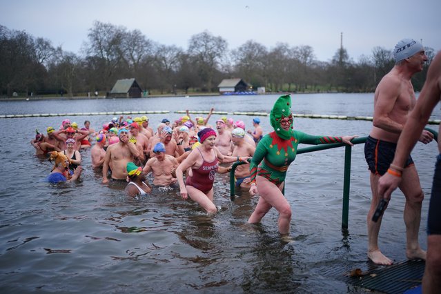 Members of the Serpentine Swimming Club take part in the Peter Pan Cup race, which is held every Christmas Day at the Serpentine, in Hyde Park, central London on Wednesday, December 25, 2024. (Photo by Yui Mok/PA Images via Getty Images)
