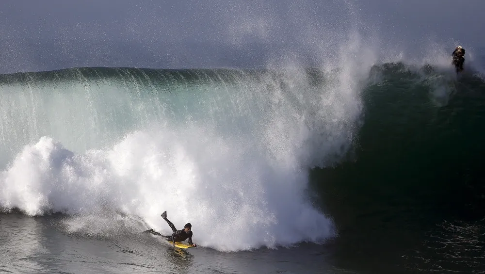 Surfers Delight in Hurricane Marie's Big Waves