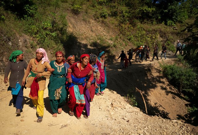 Survivors participate in a funeral of those killed in earthquake in Jajarkot district, northwestern Nepal, Sunday, November 5, 2023. Friday night’s earthquake in the district killed more than hundred people while more than fifty were killed in the neighboring Rukum district, officials said. (Photo by Niranjan Shrestha/AP Photo)