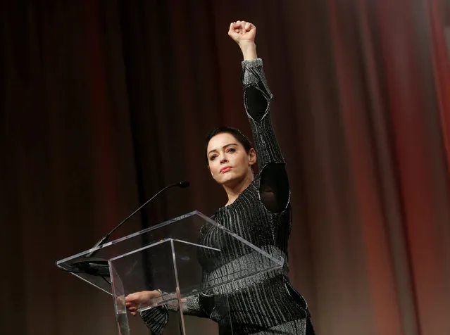 Actor Rose McGowan raises her fist after addressing the audience during the opening session of the three-day Women's Convention at Cobo Center in Detroit, Michigan, U.S., October 27, 2017. (Photo by Rebecca Cook/Reuters)