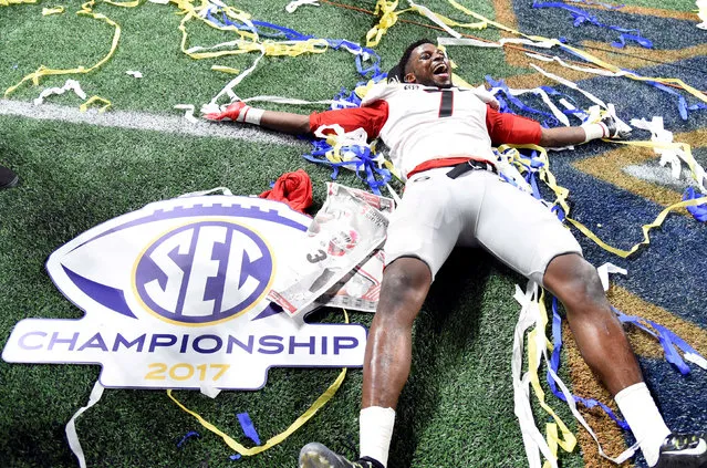 Georgia linebacker Lorenzo Carter celebrates after the Southeastern Conference championship NCAA college football game against Auburn, Saturday, December 2, 2017, in Atlanta. Georgia won 28-7. (Photo by Dale Zanine/Reuters/USA TODAY Sports)