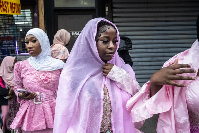 People gather for the Eid al-Fitr prayer that ends the Muslim holy month of Ramadan outside of the Masjid at-Taqwa mosque in the Brooklyn borough of New York City on March 30, 2025. (Photo by Stephanie Keith/ZUMA Press Wire/Rex Features/Shutterstock)
