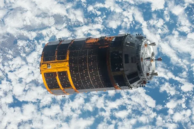 The Japan Aerospace Exploration Agency (JAXA) Kounotori 5 H-II Transfer Vehicle (HTV-5) is seen departing from the International Space Station on September 28, 2015. The cargo vehicle was berthed to the orbiting laboratory for five weeks until it was released. HTV-5 delivered almost five tons of hardware and supplies. (Photo by AFP Photo/NASA)