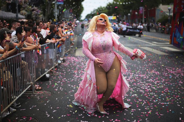 A participant walks during the annual Pride Parade in West Hollywood, California on June 1, 2025. (Photo by Daniel Cole/Reuters)