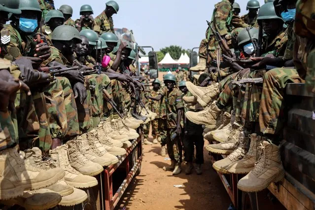 Soldiers of the South Sudan People's Defence Forces (SSPDF) prepare to be deployed to the Democratic Republic of Congo (DRC) after their departure ceremony at the SSPDF  Headquarters in Juba on December 28, 2022. South Sudan will send 750 soldiers to the eastern Democratic Republic of Congo soon to join a regional force fighting a rebel offensive, a military spokesman said Wednesday. Fierce fighting in recent months between Congolese troops and the M23 rebel group prompted the East African Community (EAC) bloc to deploy a joint regional force to quell the violence, with Kenya and Uganda also sending soldiers to the DRC. (Photo by Samir Bol/AFP Photo)