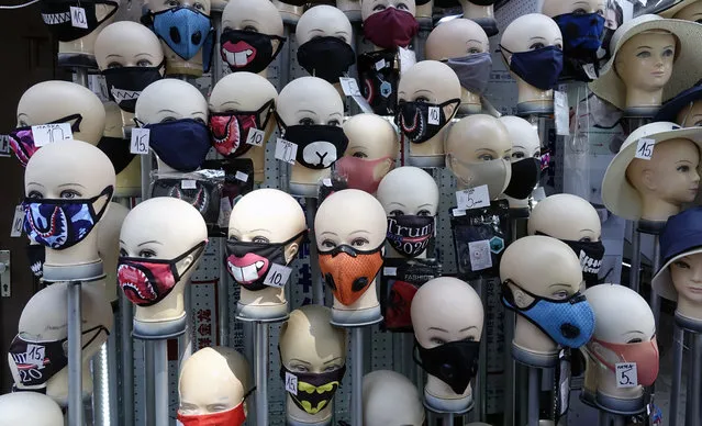 Masks placed on mannequins heads are displayed outside a shop in Sarajevo's main street, Bosnia, Monday, July 27, 2020. Regional WHO office in Bosnia expressed its concern with recent reports that medical institutions around the country are closing to maximum capacity as recent spike in COVID-19 infections are reaching record levels. (Photo by Eldar Emric/AP Photo)