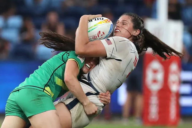 Ireland's Lucy Mulhall (L) tackles USA's Ilona Maher during the World Rugby Women's Sevens series match between Ireland and the United States at the Allianz Stadium in Sydney on January 29, 2023. (Photo by Jeremy N.G./AFP Photo)