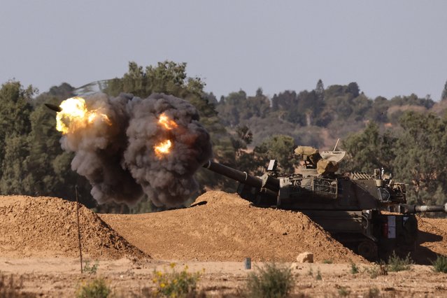 An Israeli mobile artillery unit fires a shell from a border position in southern Israel toward the Gaza Strip on May 8, 2024, amid the ongoing conflict in the Palestinian territory between Israel and the Hamas movement. (Photo by Jack Guez/AFP Photo)