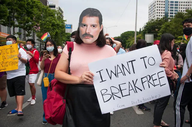 A protester wearing a hand-made paper mask of Freddie Mercury holds a placard during the demonstration in Bangkok, Thailand on November 7, 2020. LGBTQ+ and pro-democracy protesters march from Samyan Intersection to Silom in the centre of Bangkok to call for LGBTQ+ rights and the end of sexual harassment, the protesters also demanded the resignation of Thailand Prime Minister and the reform of the monarchy. (Photo by Peerapon Boonyakiat/SOPA Images/Rex Features/Shutterstock)