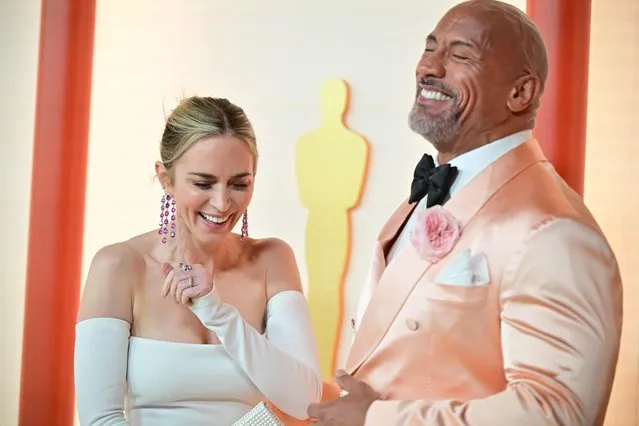 British actress Emily Blunt and US actor Dwayne Johnson attend the 95th Annual Academy Awards at the Dolby Theatre in Hollywood, California on March 12, 2023. (Photo by Frederic J. Brown/AFP Photo)