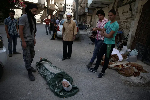 Actors perform a scene in a film directed by Humam Husari in the rebel-held besieged town of Zamalka, in the Damascus suburbs, Syria September 19, 2016. (Photo by Bassam Khabieh/Reuters)