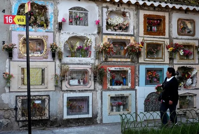 A woman walks past at the General Cemetery in La Paz, Bolivia, October 26, 2016. (Photo by David Mercado/Reuters)