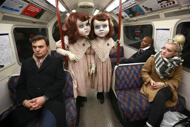 Two life-size Victorian style dolls shocked Londoners morning December 3, 2015 as the creepy pair popped up at commuter hotspots across the capital to mark the launch of the world's first psychological theme park ride created by Derren Brown, coming to Thorpe Park Resort in 2016. (Photo by Matt Alexander/PA Wire)